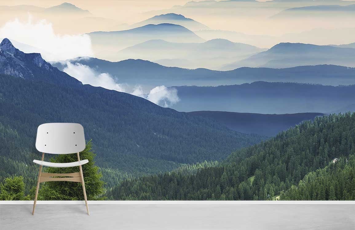 Tranquil Misty Mountain Green Mural Wallpaper, wooden chair on grey floor in serene room.