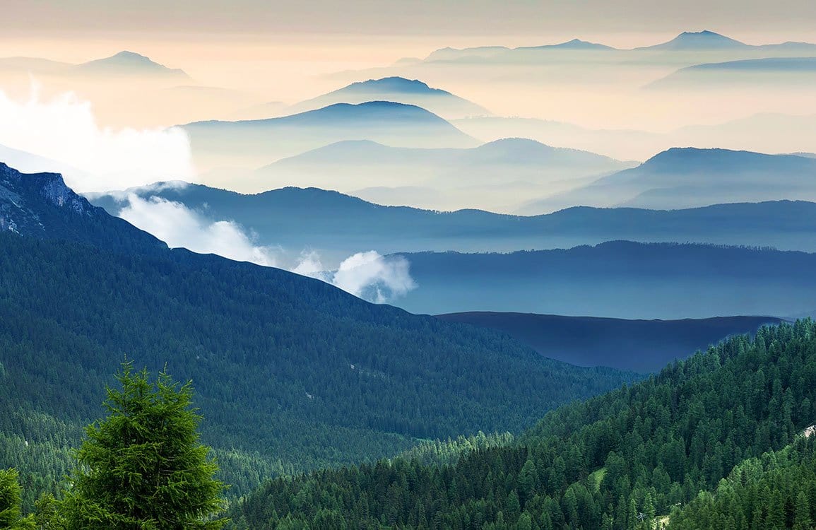 Tranquil Misty Mountain Green Landscape Mural Wallpaper for Serene Interiors