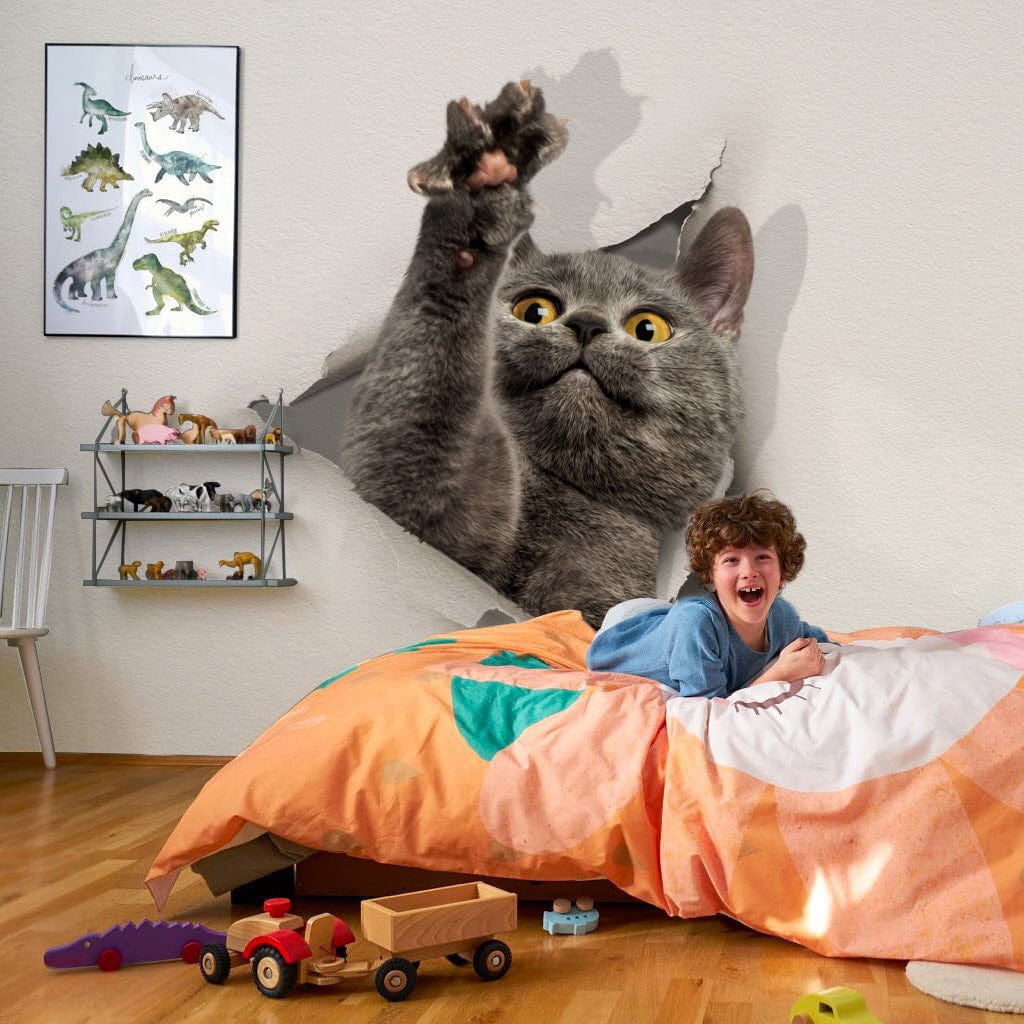 Grey Cat 3D Mural Wallpaper in children's room with wooden flooring, orange duvet, wall art, toys.