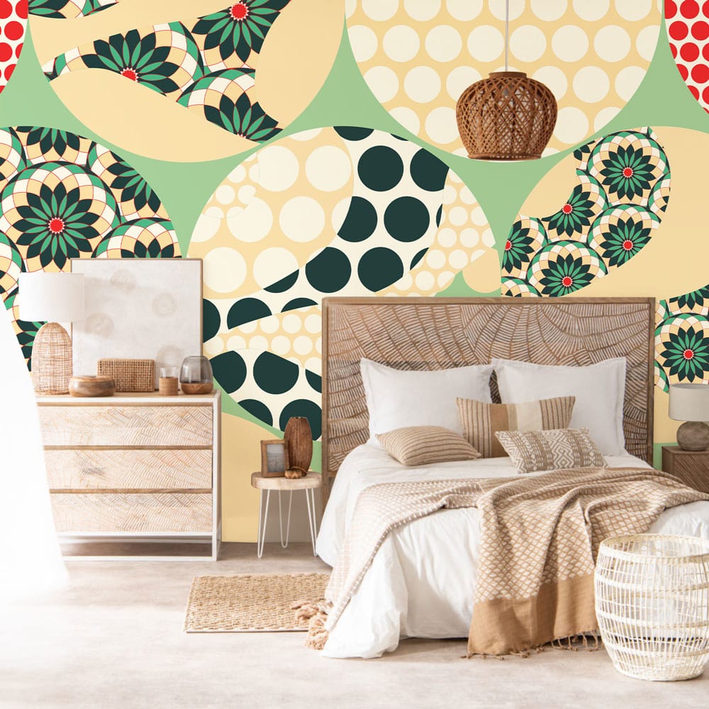 Retro Geometric Circles Wallpaper with Green, Beige, Red; natural wood dresser; cosy bedroom setting.