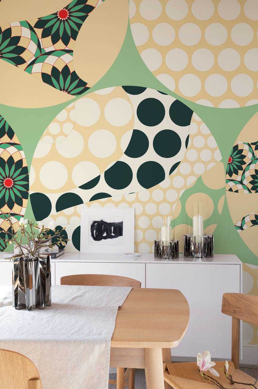 Retro Geometric Circles Wallpaper with Green, Beige, Red; dining room white console, lightwood table.