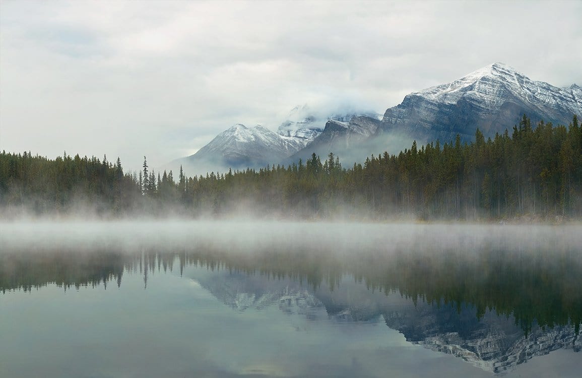 Serene Misty Mountain Lake Scene: Tranquil Green Nature Mural Wallpaper