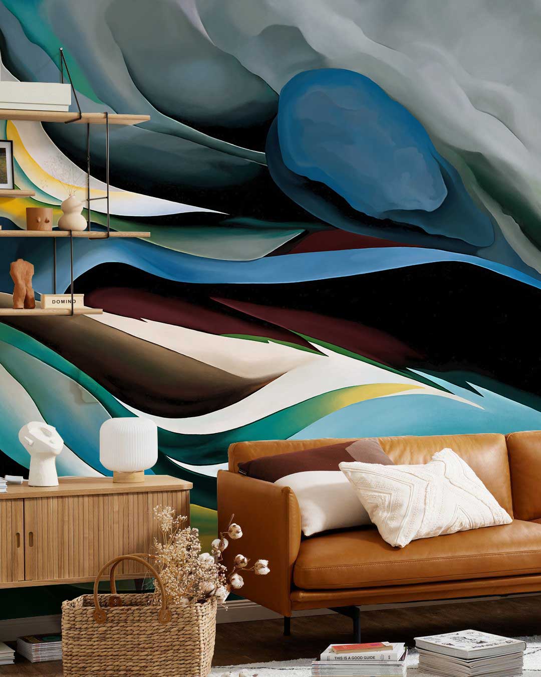 Elegant Abstract Waves Mural Wallpaper, teal-green hues, brown leather sofa, wooden cabinet, modern lounge setting.