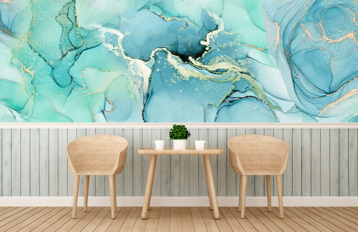 Two wooden chairs and table, turquoise abstract mural wallpaper, gold accents, wood flooring, minimalist decor.