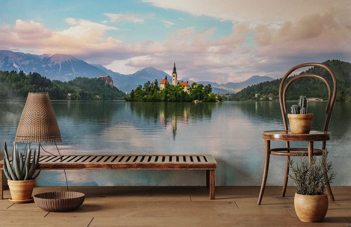 Tranquil Mountain Lake Landscape Mural Wallpaper in living room with wooden flooring, rustic chair, and bench.