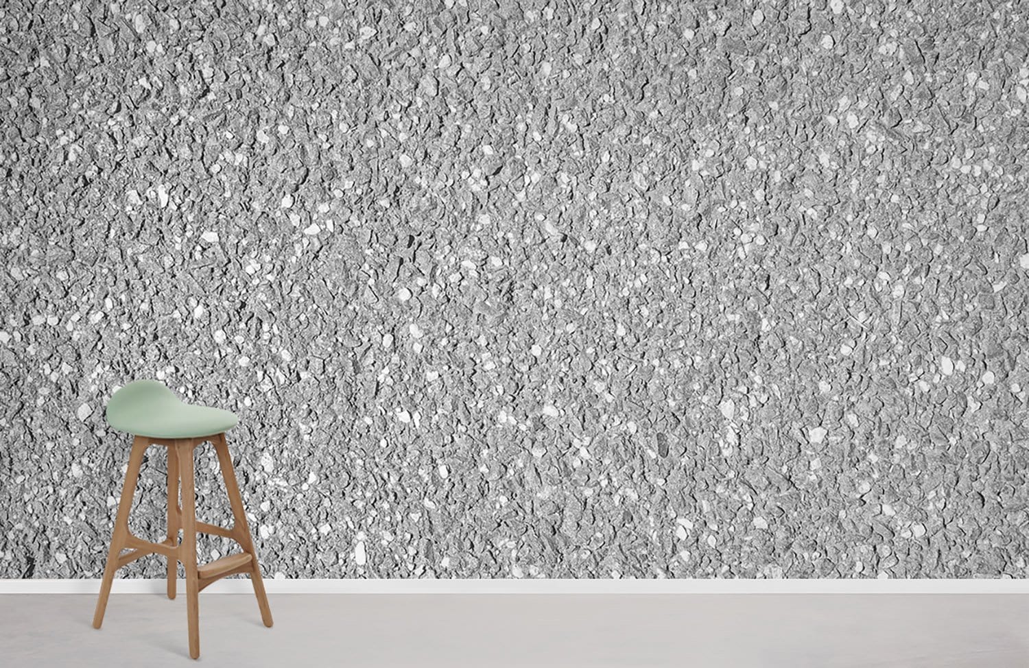 Elegant grey granite stone effect wallpaper with light wood stool, ideal for modern interior design.