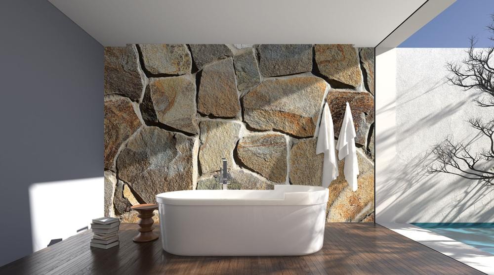 Rustic Stone Wall Mural Wallpaper in bathroom with freestanding bathtub, wood flooring, and natural decor.