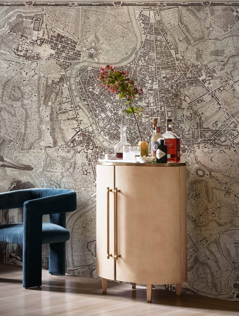 Vintage City Map Mural Wallpaper with elegant cabinet, blue velvet chair, wooden flooring in living room.