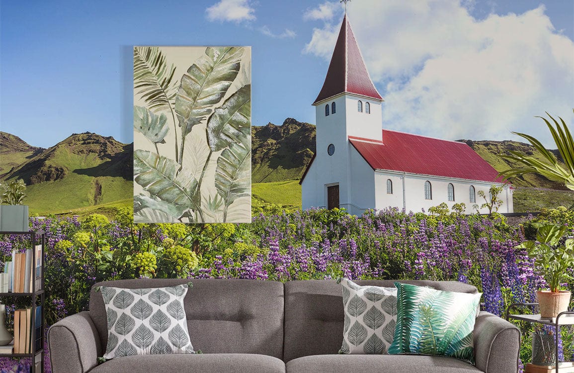 Idyllic Countryside Church Wallpaper, grey sofa, colourful mural, lush wildflowers, living room setting.
