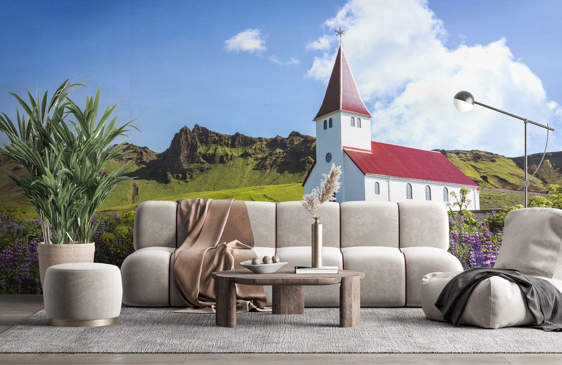 Idyllic countryside church mural wallpaper with wildflowers, cream sofa, wooden table, grey rug in lounge.