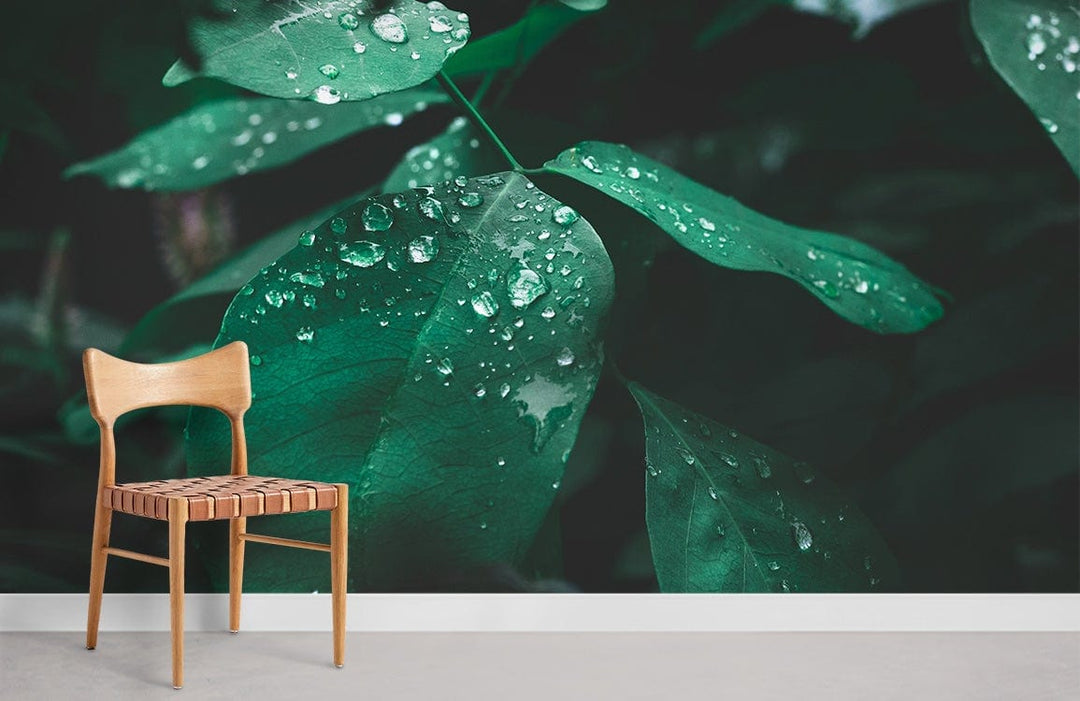 Emerald Green Botanical Leaves Mural Wallpaper with Dew Drops, wooden chair, minimalist decor, light flooring.