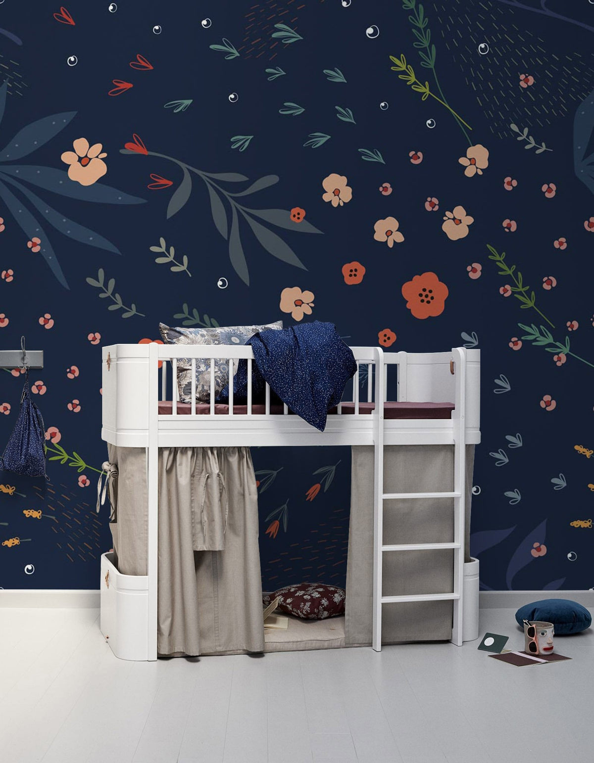 Dark Blue Floral Pattern Wallpaper in children's room; white loft bed, light wood flooring, elegant design.