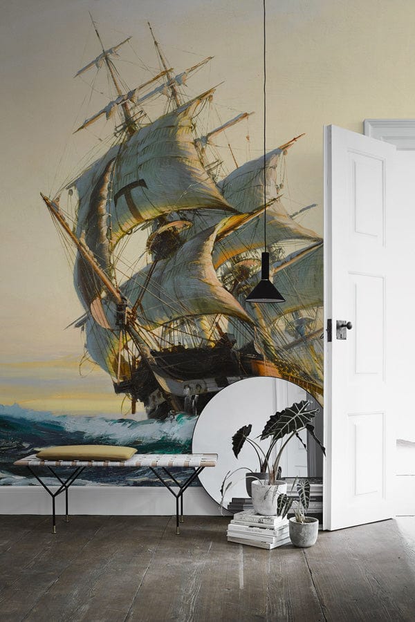 Vintage nautical mural wallpaper; sailing ship theme; wooden flooring; white walls; modern minimalist decor.