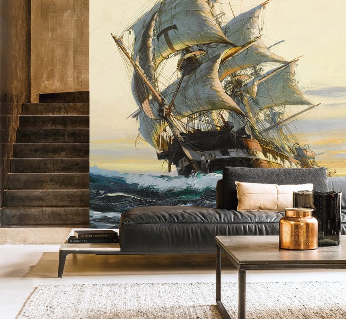 Vintage nautical sailing ship mural wallpaper in earthy tones, with black leather sofa and staircase.