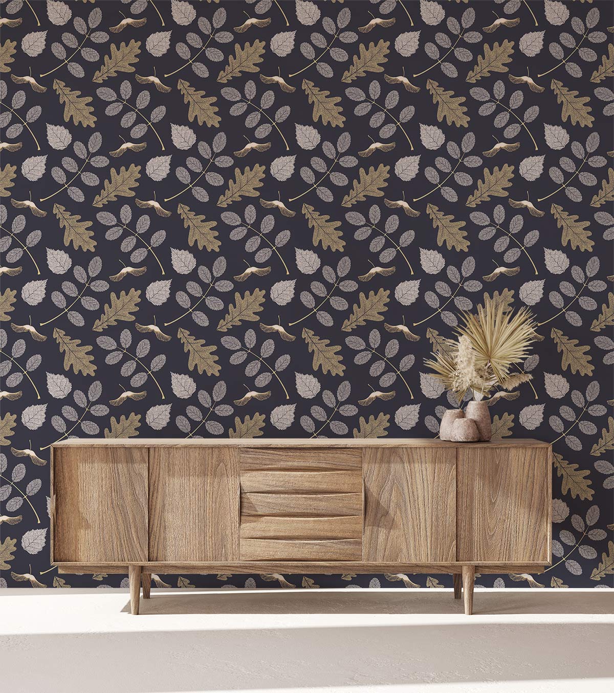Botanical leaf wallpaper in navy and gold, wooden sideboard, minimal decor, neutral flooring.