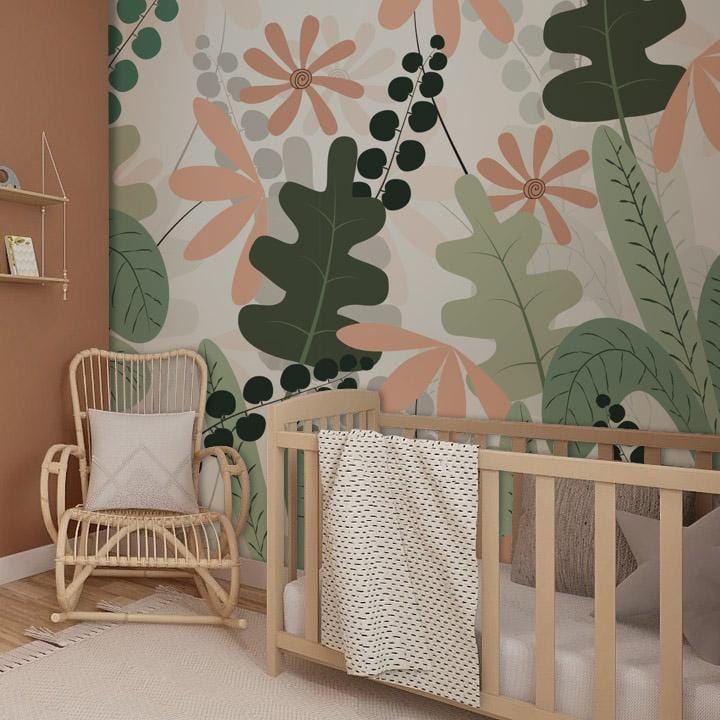 Tropical Botanical Oasis wallpaper in nursery with rattan chair, natural wooden cot, and warm walls.