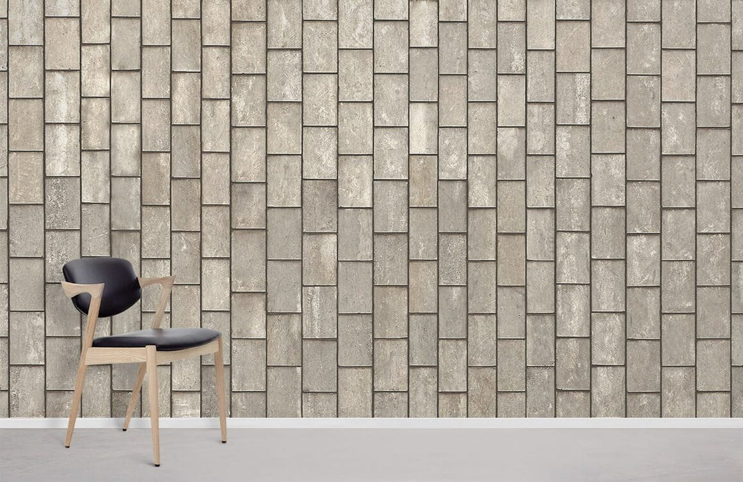 Rustic grey brick wallpaper, stone effect, modern chair on light grey flooring, contemporary room style.