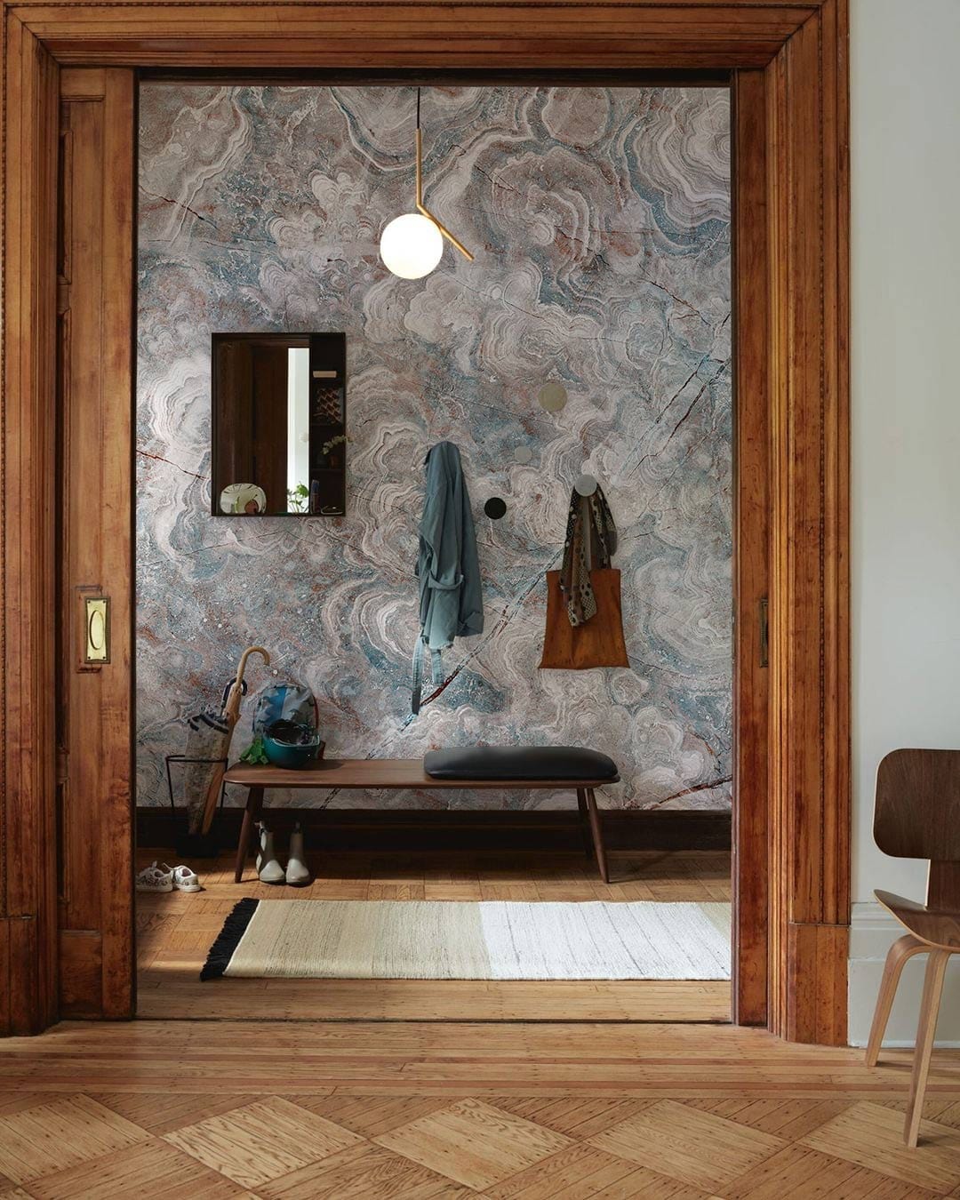 Elegant Marbled Cloudy Texture Blue and Brown Mural Wallpaper, hallway, wooden bench, parquet flooring, rug.