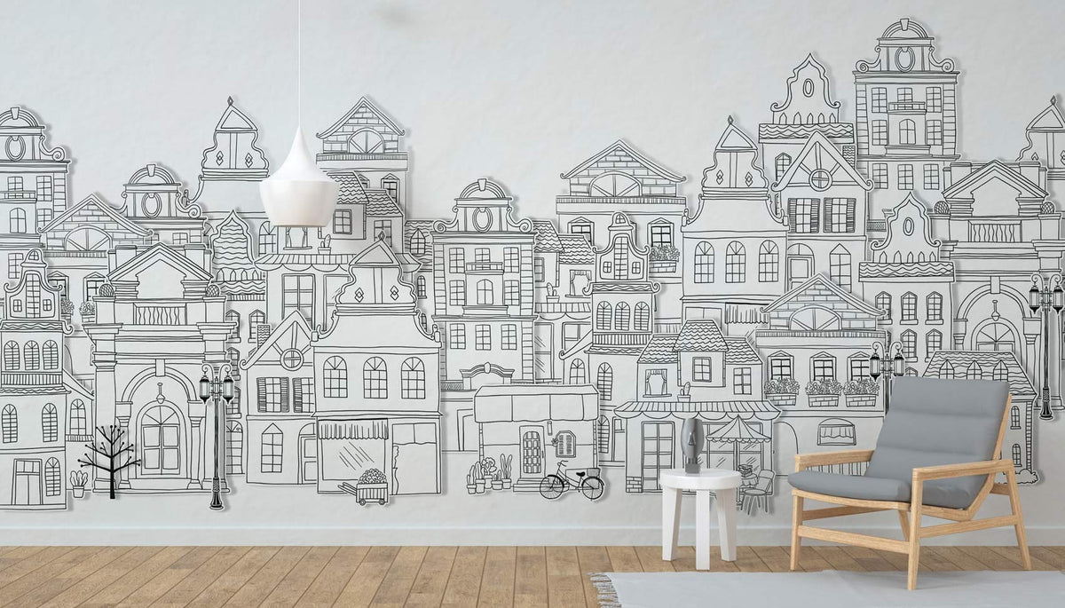 Vintage Monochrome Cityscape Mural Wallpaper in lounge; wooden flooring; grey armchair; pendant light.