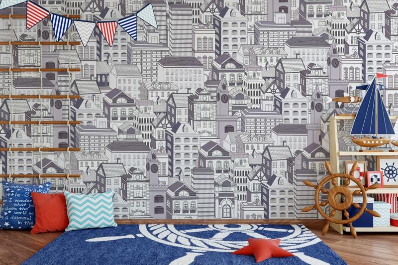 Monochrome cityscape wallpaper in nautical-themed kids room, featuring patterned rug, wooden floor, playful decor.
