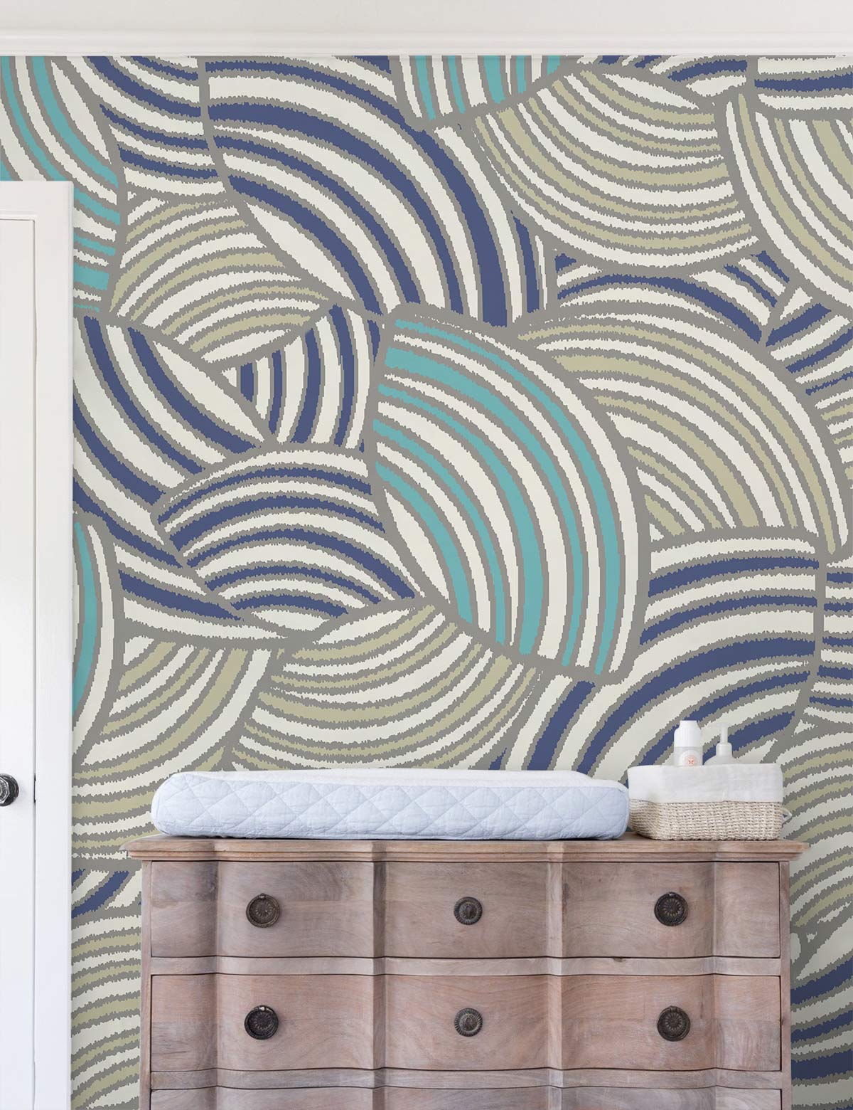 Retro Geometric Waves Wallpaper in teal and beige with Art Deco style behind wooden dresser.