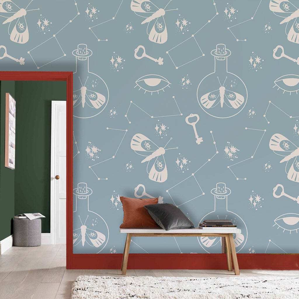 Mystical Blue Celestial Moth Wallpaper, red-framed mirror, wooden bench, light wood flooring, cosy setting.