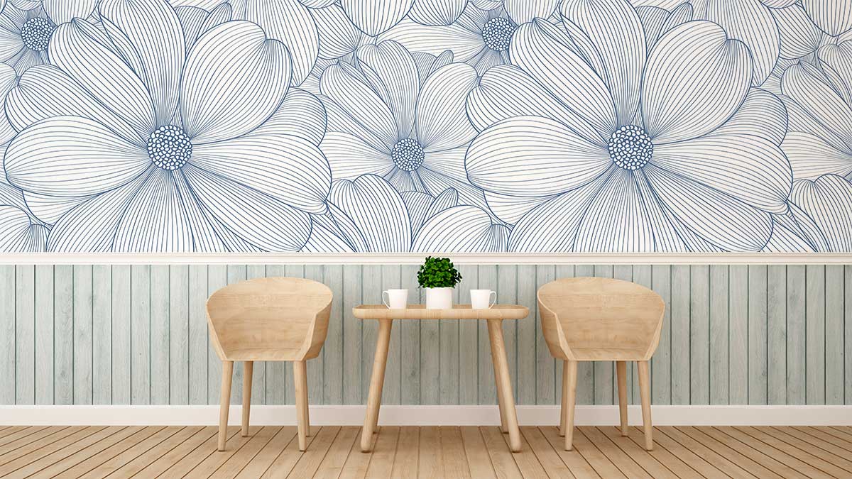 Elegant blue floral pattern wallpaper in modern chic room with minimalist wooden chairs and table.