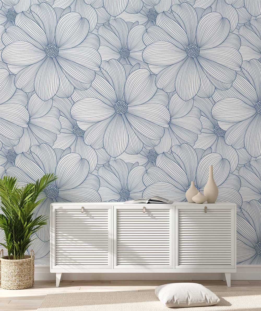 Elegant blue floral wallpaper, modern interior with white sideboard, light flooring, and decorative vases.