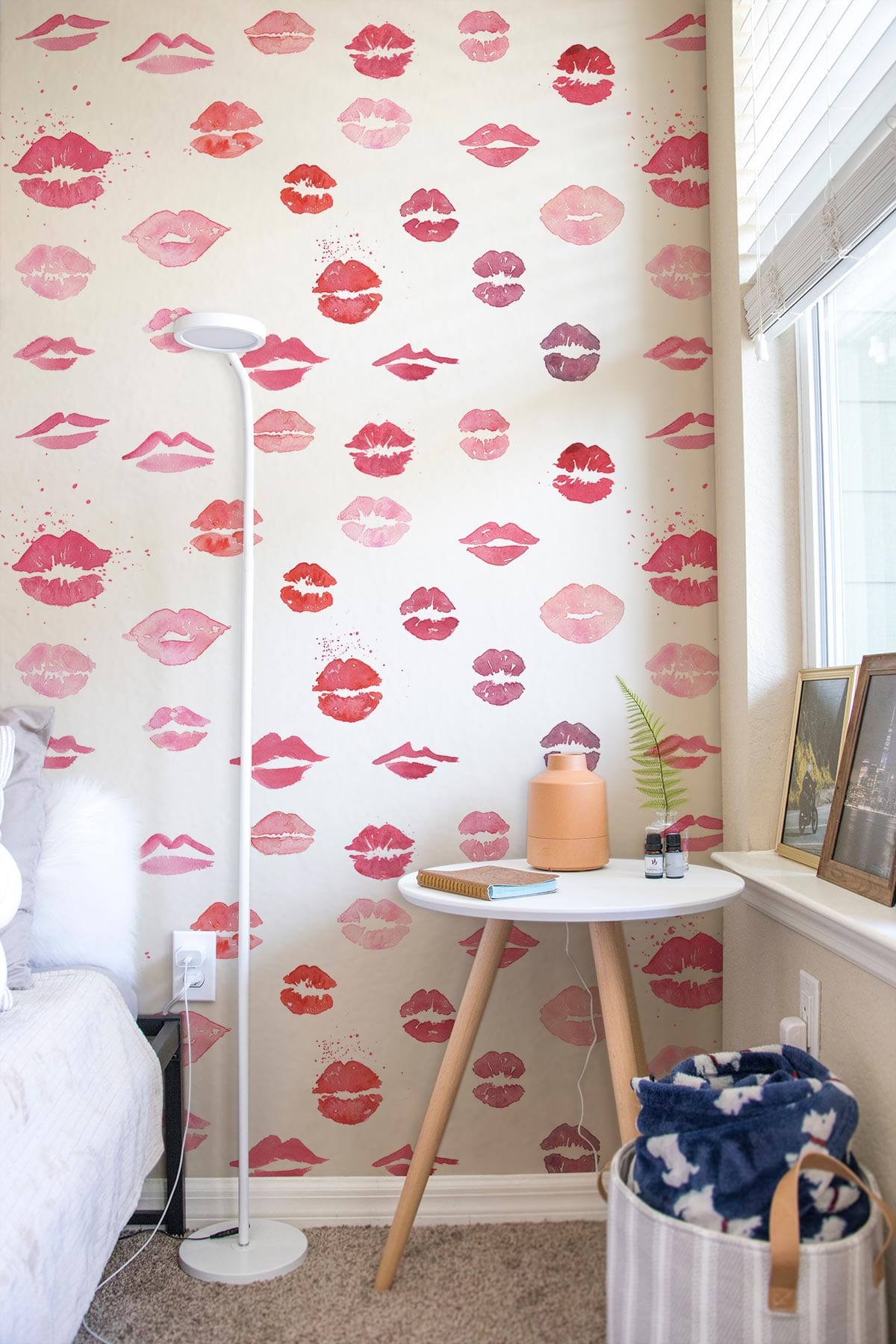 Chic Pink Lips Pattern Wallpaper in a cosy bedroom with light grey carpet and modern decor.