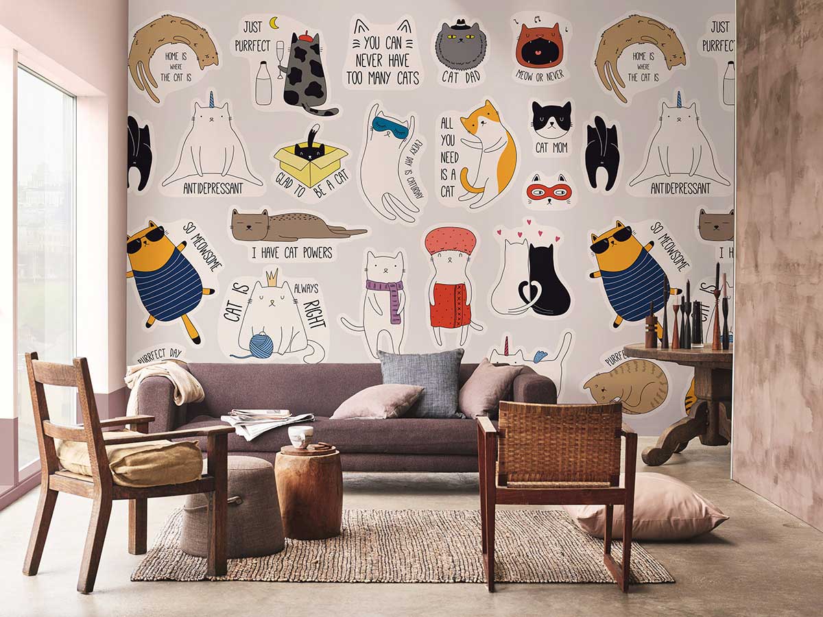 Playful cat-themed mural for children's rooms; multicoloured with brown sofa, wooden chairs, modern decor.