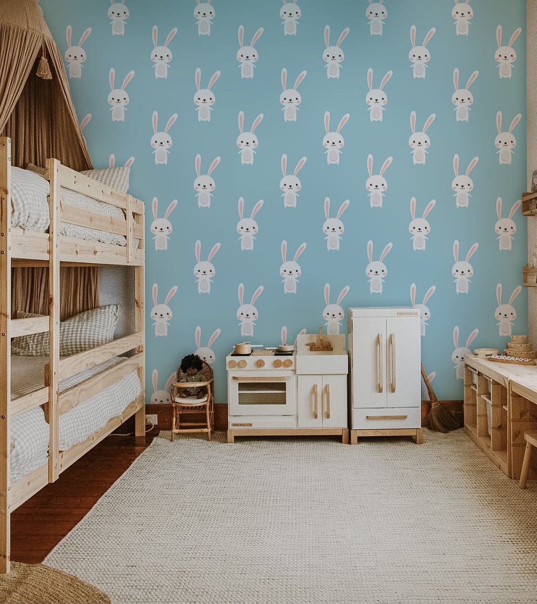 Charming Pastel Bunny Wallpaper in kids' room, featuring wooden bunk beds, play kitchen, and beige rug.