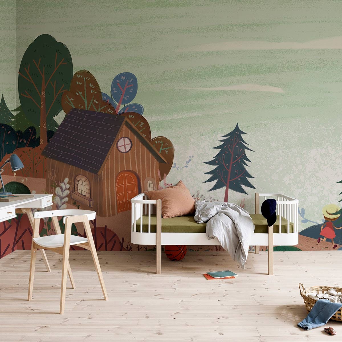 Whimsical Woodland Cottage Mural in pastel green, children's room with a white bed and wooden flooring.