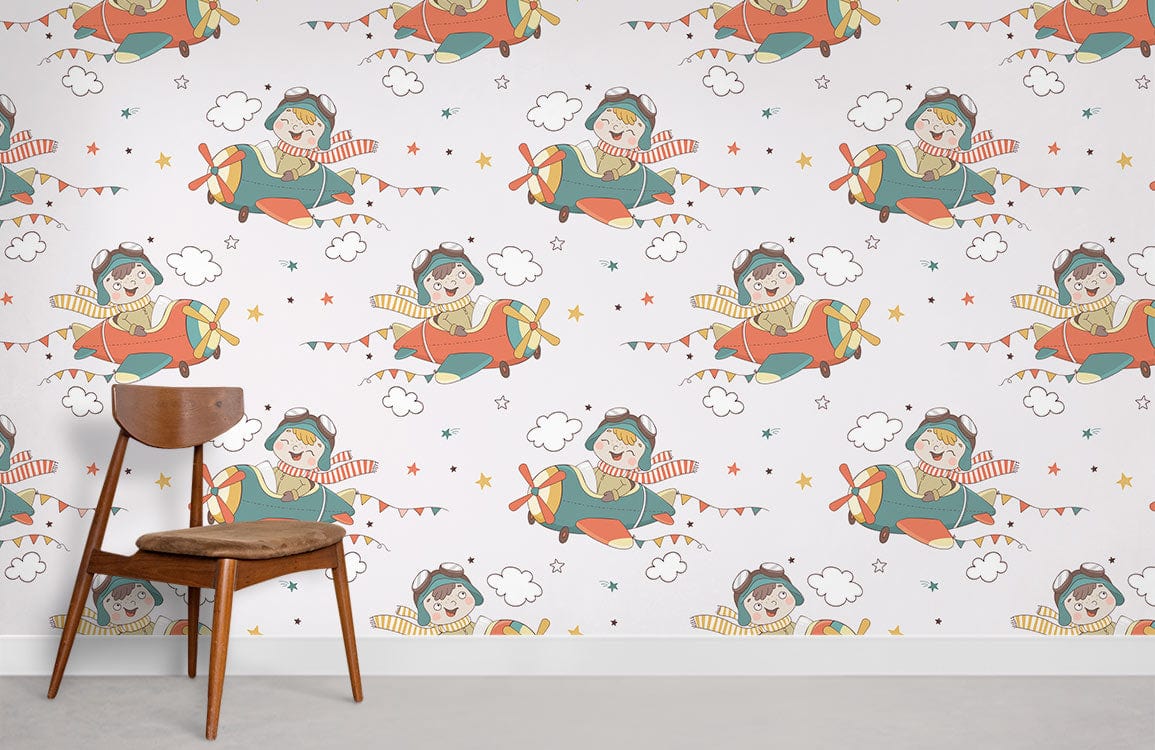 Multicolour aviator-themed kids' mural wallpaper with wooden chair, white wall, concrete flooring in children's room.