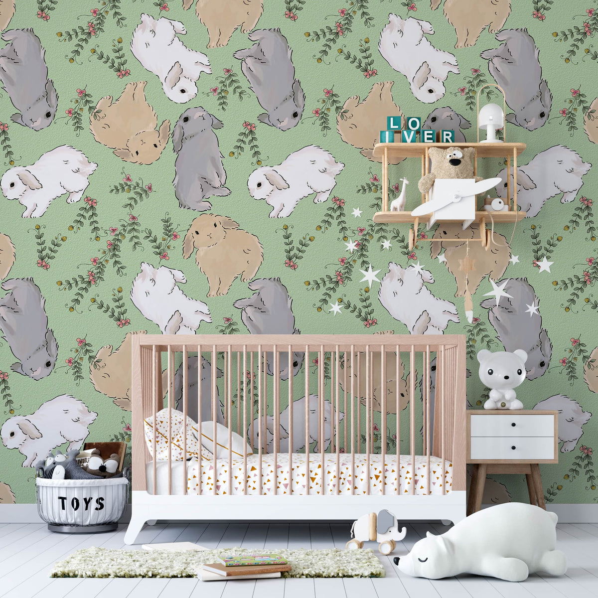 Whimsical bunny wallpaper in pastel tones with crib, green wall, children's room, playful decor.