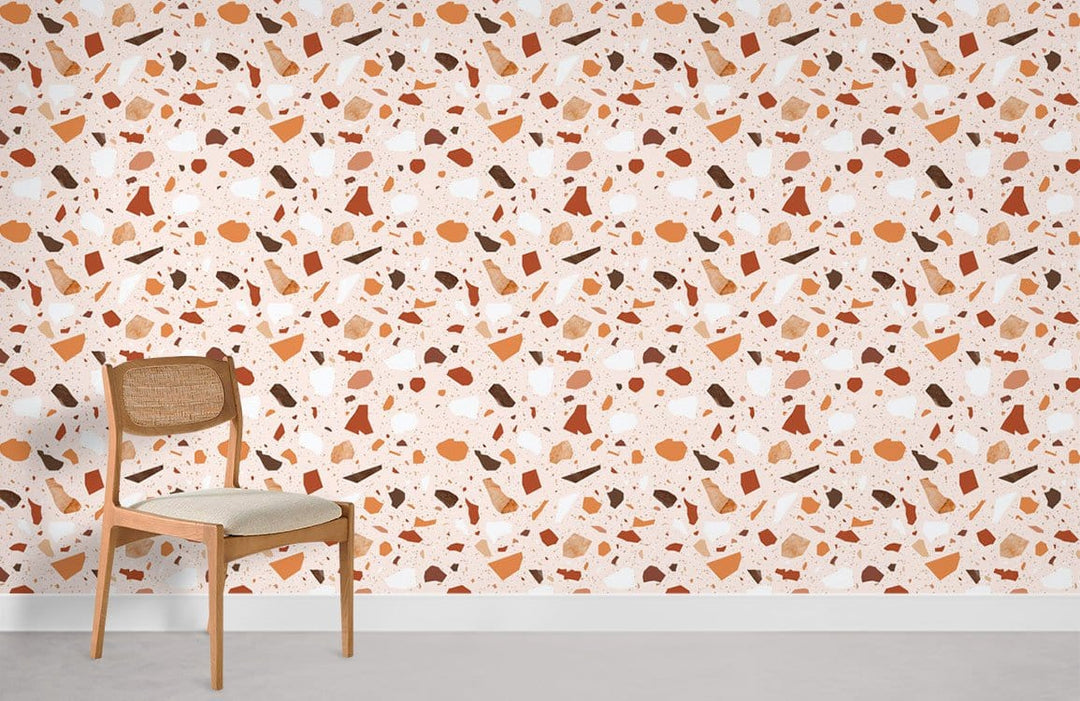 Earthy Terrazzo Pattern Wallpaper in warm tones, modern chair, neutral flooring, minimalist interior design.