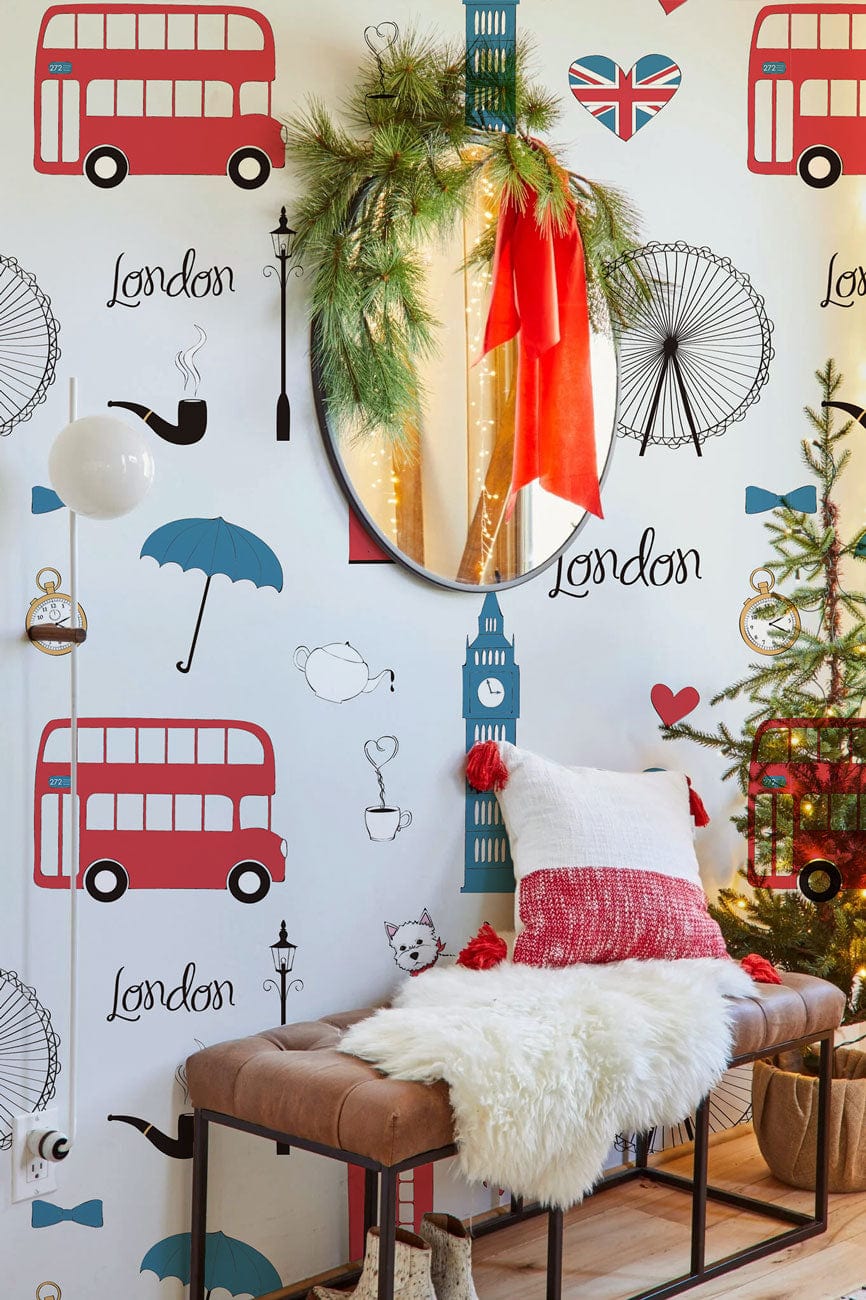 London-inspired wallpaper with iconic motifs, mirrored decoration, bench seating, festive decor, wooden flooring.