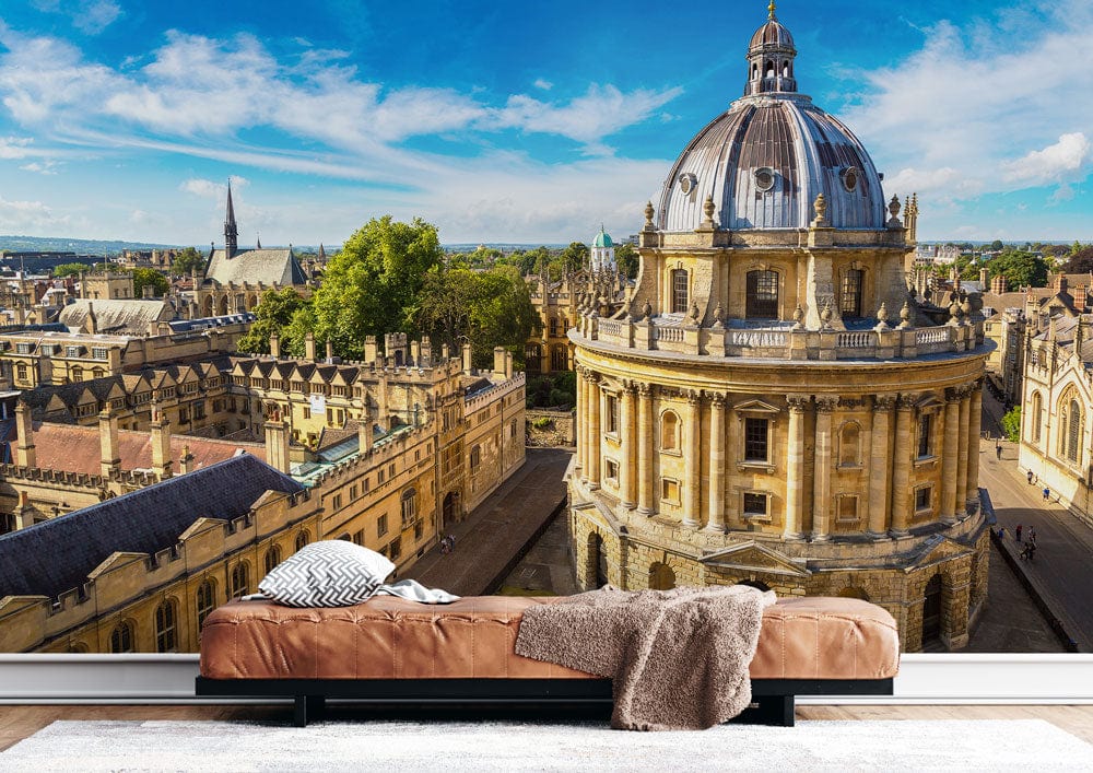 Historic Oxford Skyline mural in modern living room, brown sofa, light wood flooring, classic architecture.