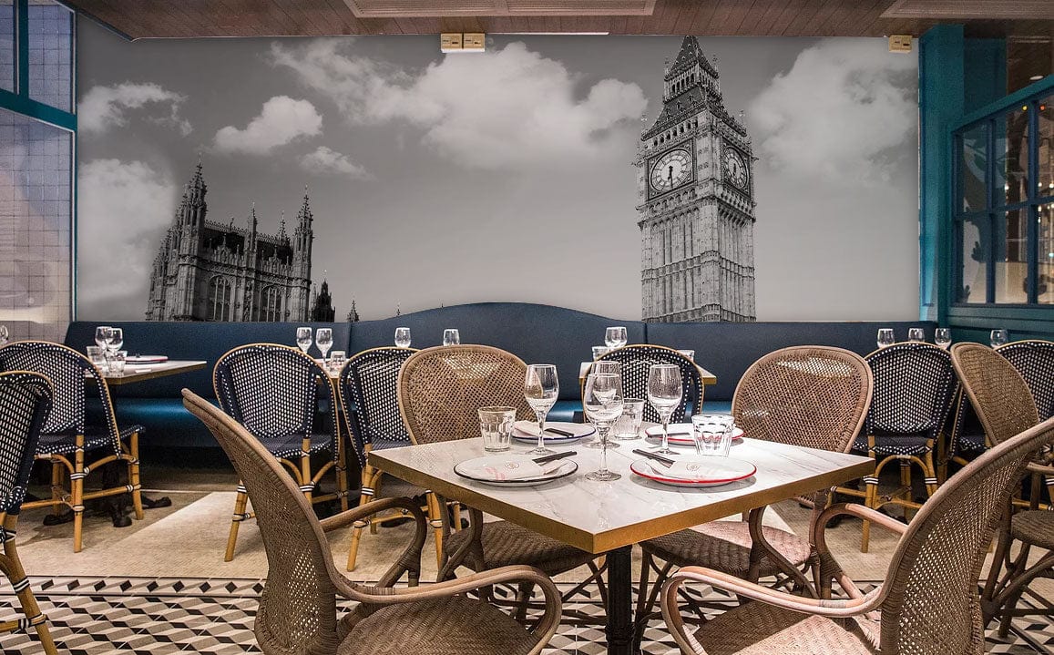 Classic London wallpaper mural featuring red bus, Big Ben, wicker chairs, restaurant setting, tiled flooring.