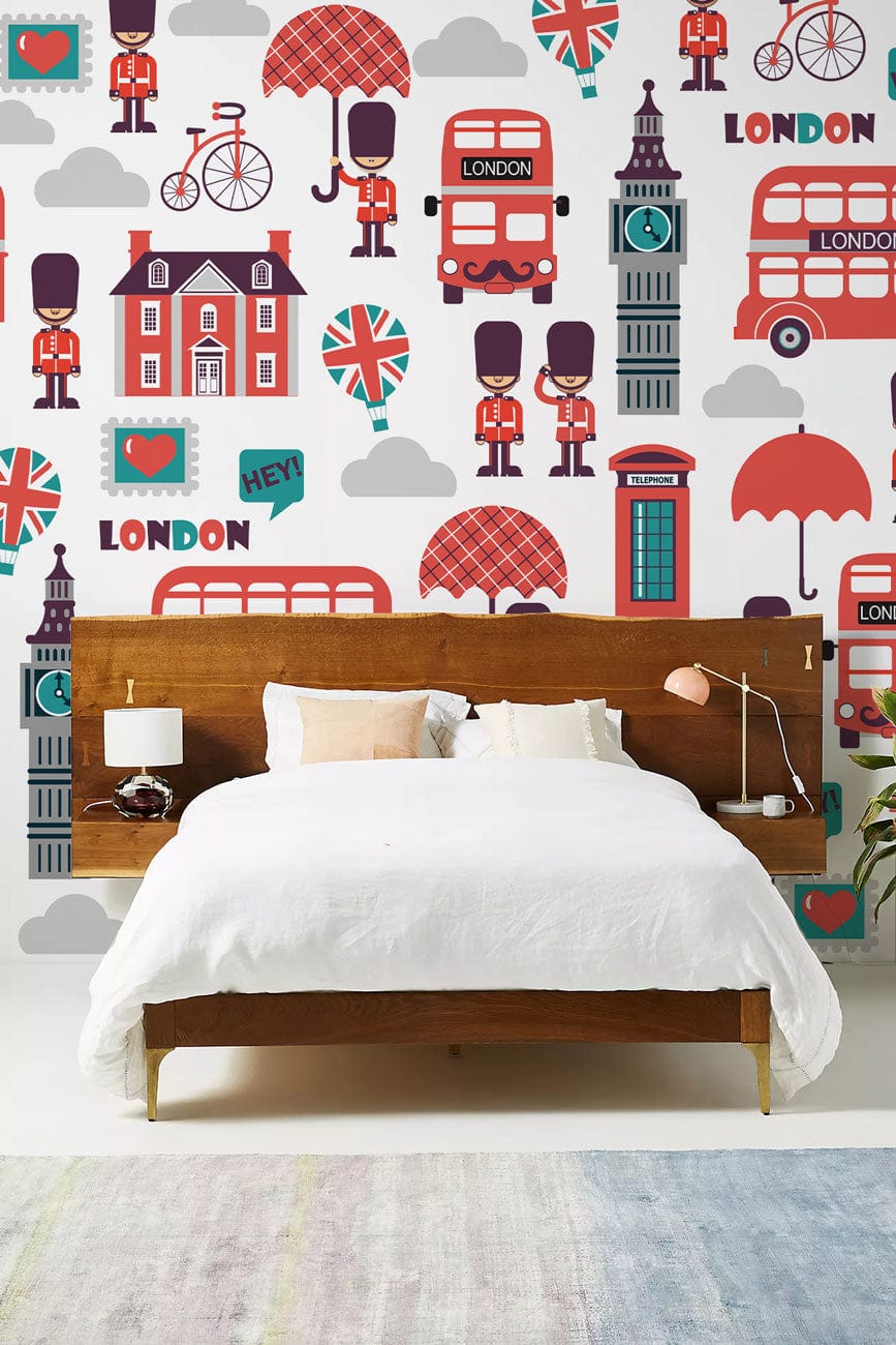 Charming London Icons red blue wallpaper; wooden bed; white bedding; bedroom decor; colourful mural.