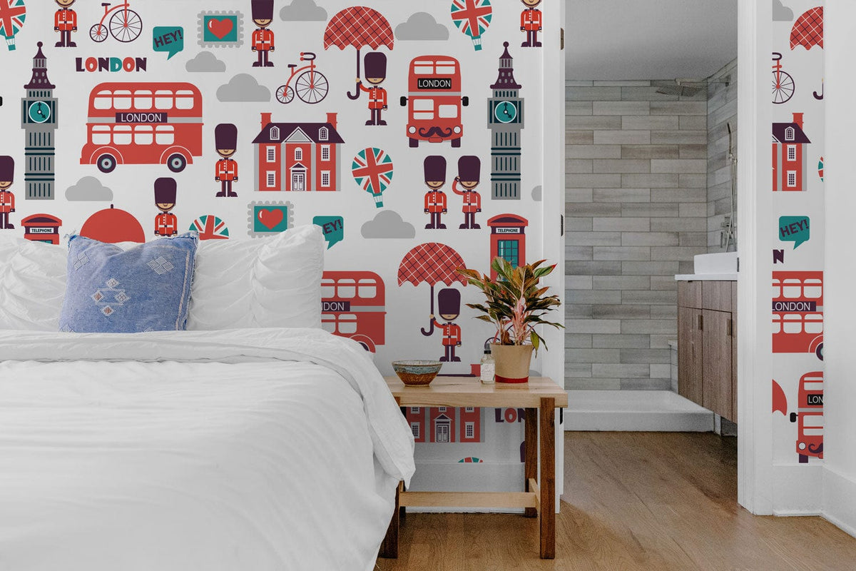 Bedroom with London-themed wallpaper, white bedding, wooden flooring, and visible bathroom area.