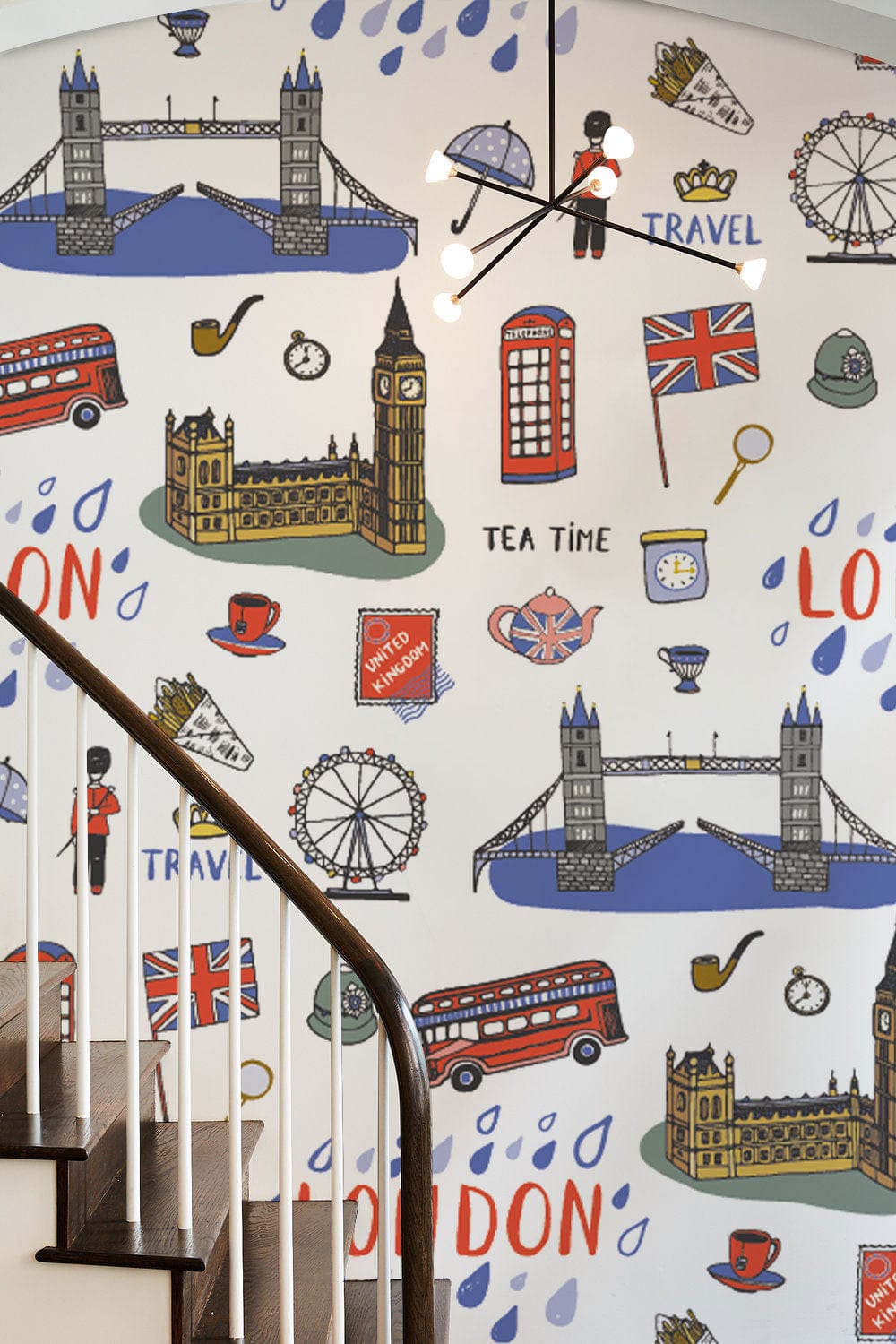 Charming London Icons Wallpaper in vibrant colours decorates staircase wall with classic wooden railing.