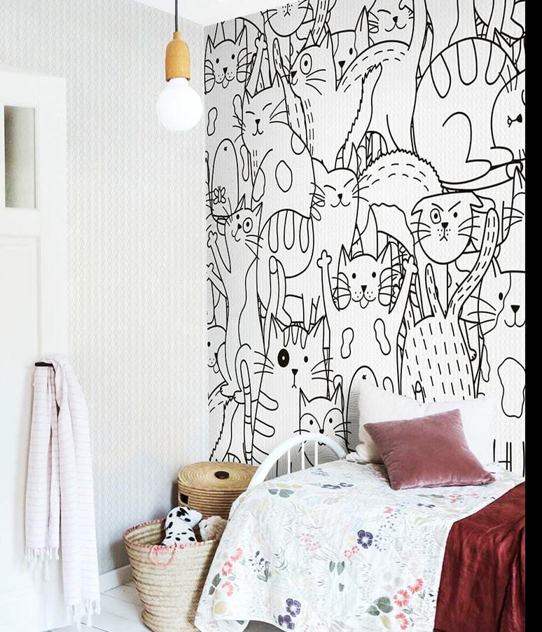 Monochrome Cats Wallpaper: Whimsical design with a cosy bedroom, patterned bedding, wicker baskets, hanging light.