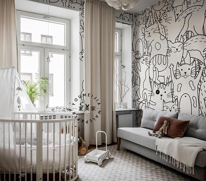 Monochrome Cats Patterned Wallpaper decor in nursery with grey sofa, round crib, and light curtains.