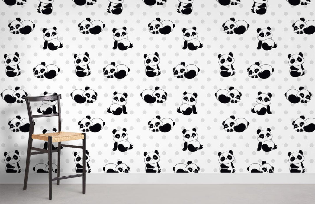 Cheerful Panda nursery wallpaper with polka dots, featuring a black wooden chair and grey flooring.