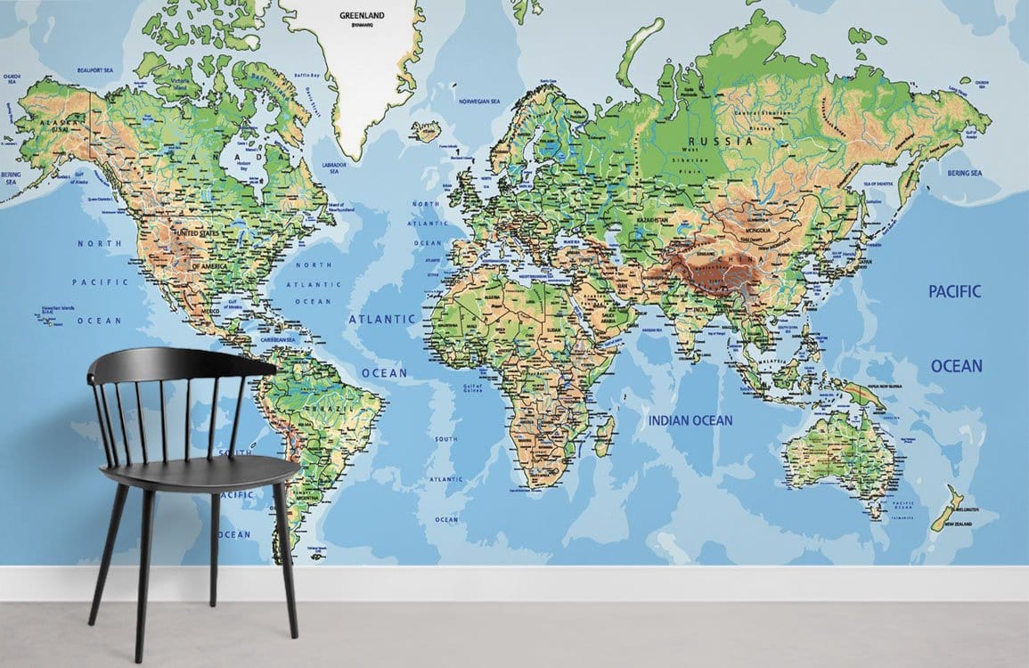 Vintage World Map Mural Wallpaper with detailed features, blue-green tones, black chair, grey floor.