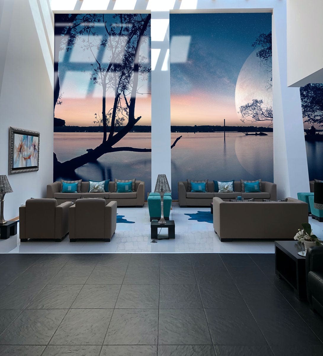 Elegant living room features Tranquil Twilight Lagoon mural, grey sofas, black tile flooring, celestial wallpaper.