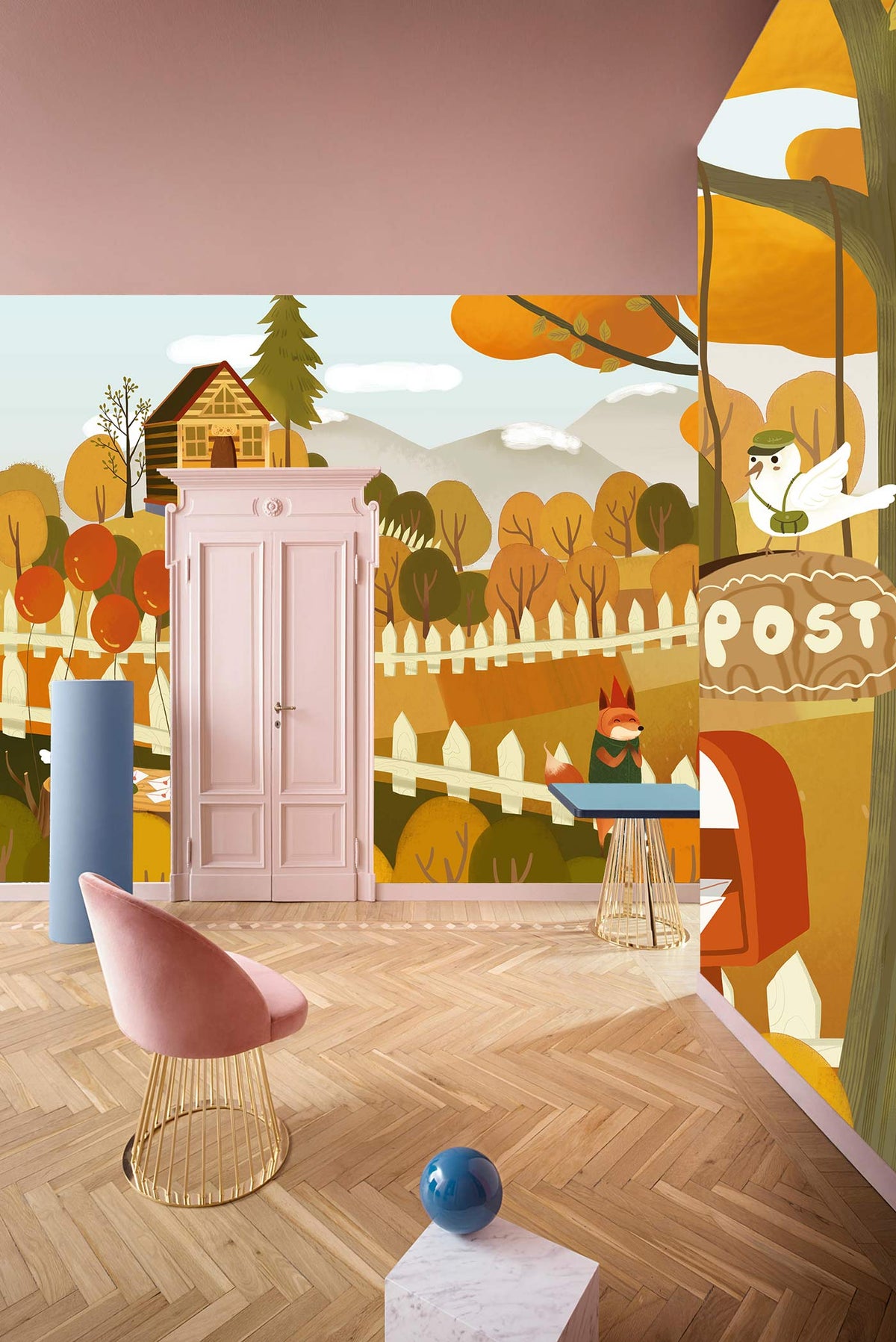 Alt text: Autumn Woodland Creatures mural in cosy cottage room with pink door, pink chair, wood flooring.