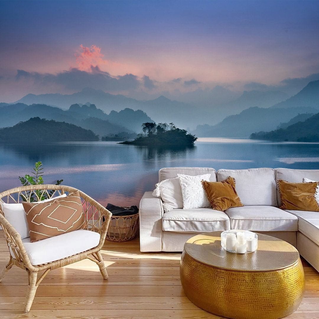 Serene Blue Mist Mountain Lake Wallpaper in cosy living room, featuring neutral sofa and wicker chair.