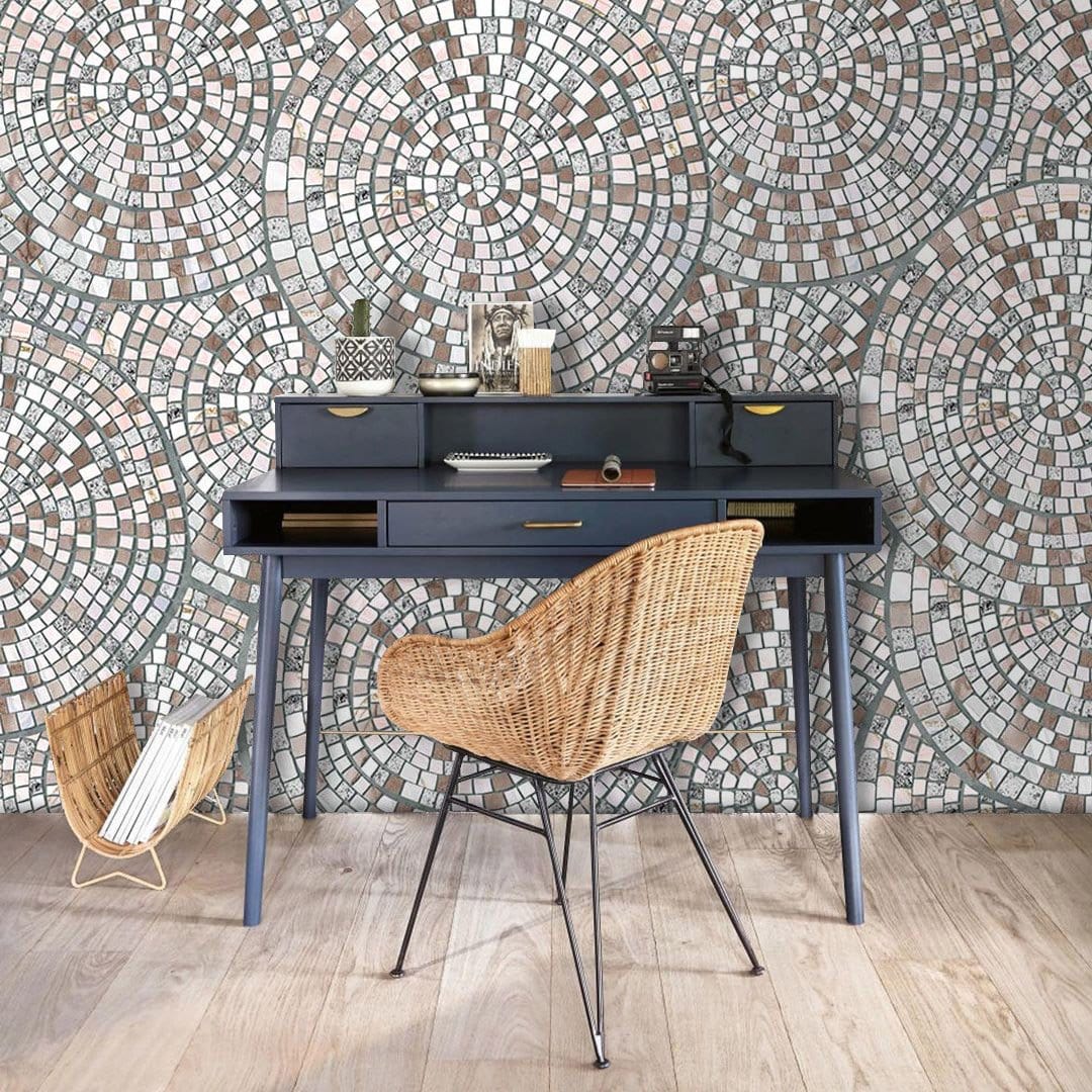 Vintage Mosaic Tile Wallpaper behind dark desk, wicker chair, wood flooring in modern home office.