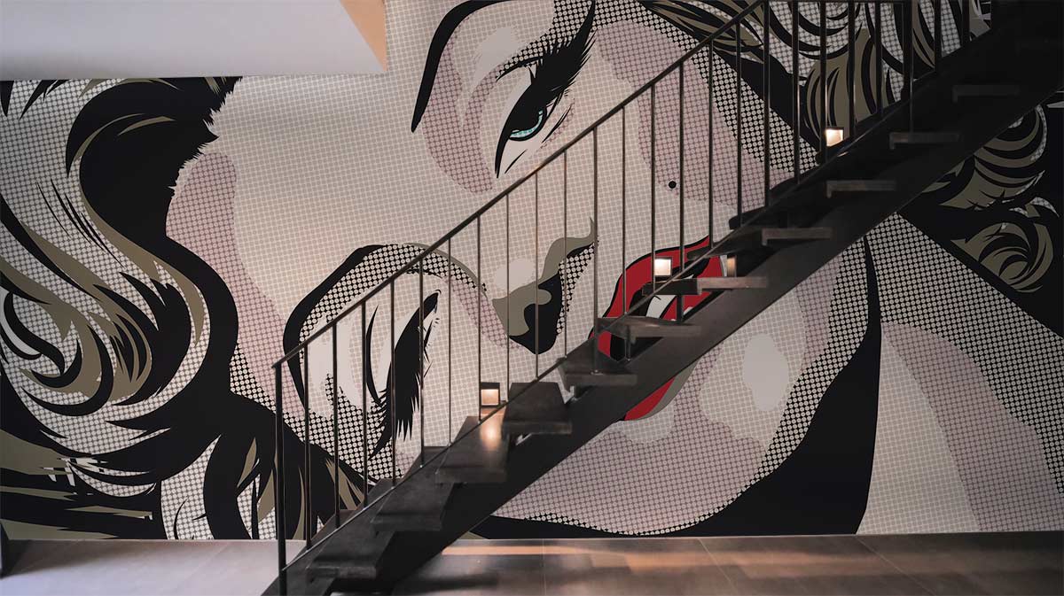 Retro Pop Art Glamour mural wallpaper, monochrome, red palette, black staircase, modern industrial style room.